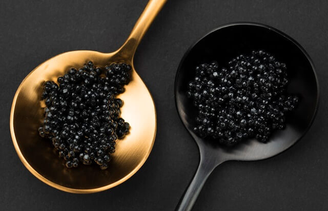 golden-black-spoon-with-caviar